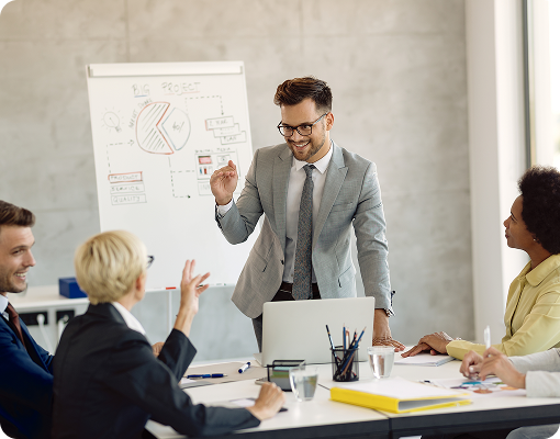 business coach presenting strategy session to team in meeting room