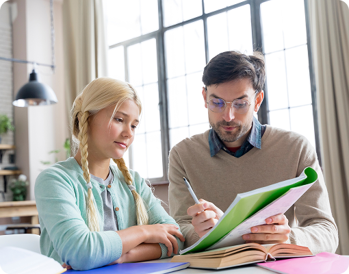 private tutor helping student with books during lesson