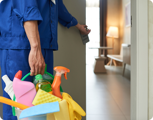 Cleaner preparing supplies for Airbnb turnover cleaning.