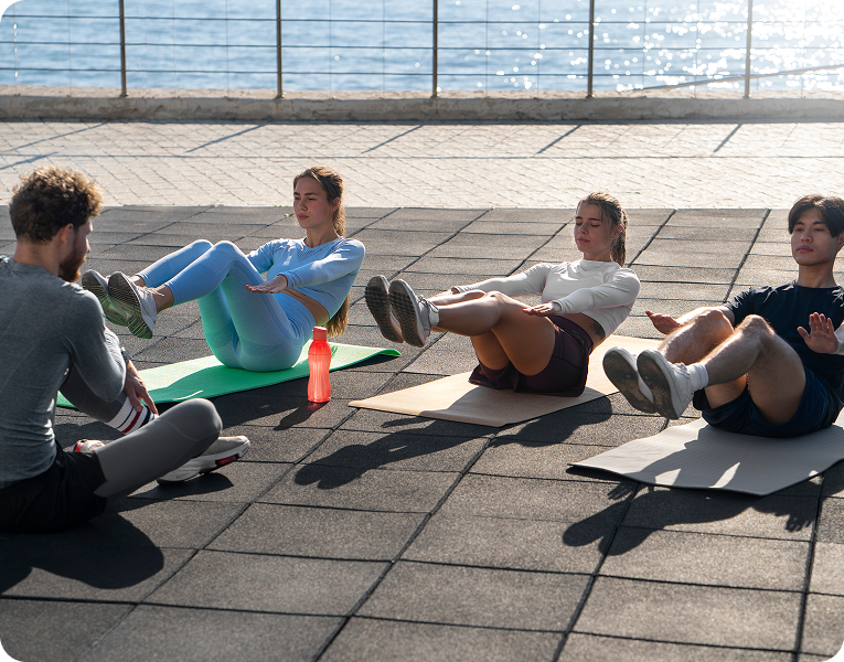 Outdoor bootcamp fitness class with group training.