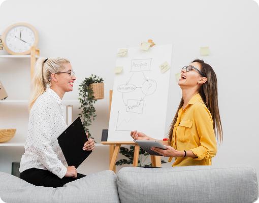 life coach working with client using whiteboard during session