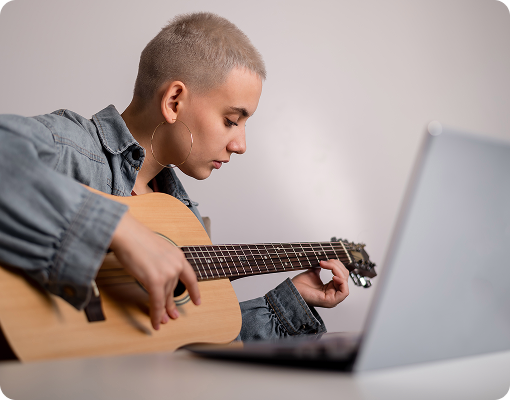 student taking online guitar lesson through virtual music teaching app